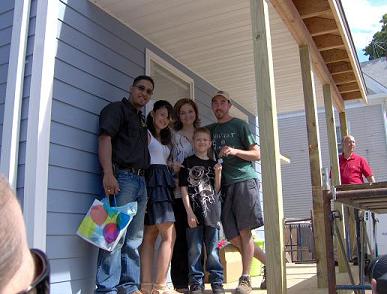 Kevin Moore presenting key chain to Navarro Fam